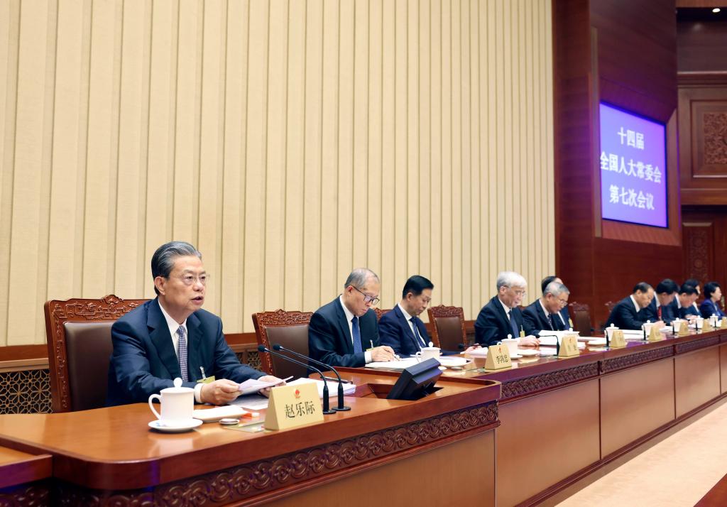 Zhao Leji, chairman of the National People's Congress (NPC) Standing Committee, presides over the closing meeting of the seventh session of the 14th NPC Standing Committee at the Great Hall of the People in Beijing, capital of China, December 29, 2023. /Xinhua