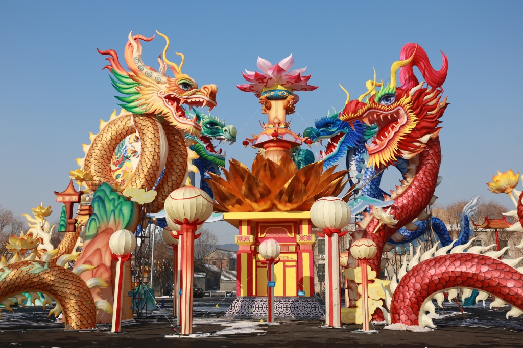 The largest lantern set featuring five dragons encircling a lotus flower is seen at Guandong Movie Town in Shenyang, northeast China's Liaoning Province, on December 28, 2023. /CFP