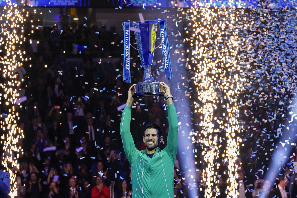 Novak Djokovic lifts the trophy after winning the singles final tennis match of the ATP Finals in Turin, Italy, November 19, 2023. /CFP