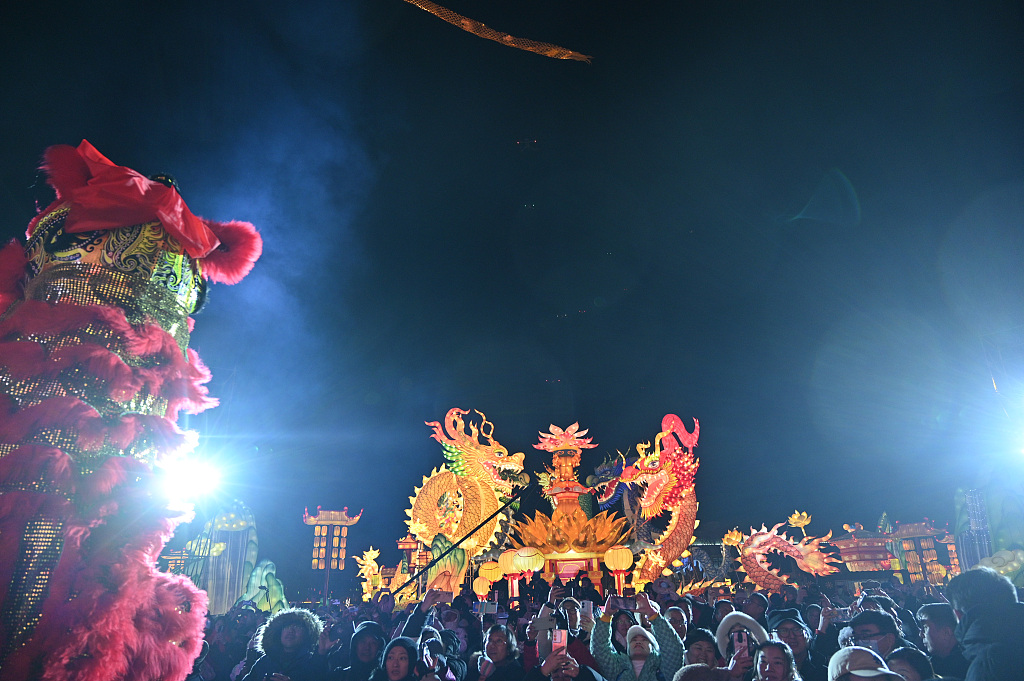 People take photos at Guandong Movie and TV Town in Shenyang, Liaoning Province, on December 29, 2023. The town is the venue for a lantern fair heralding Spring Festival in February 2024. /CFP