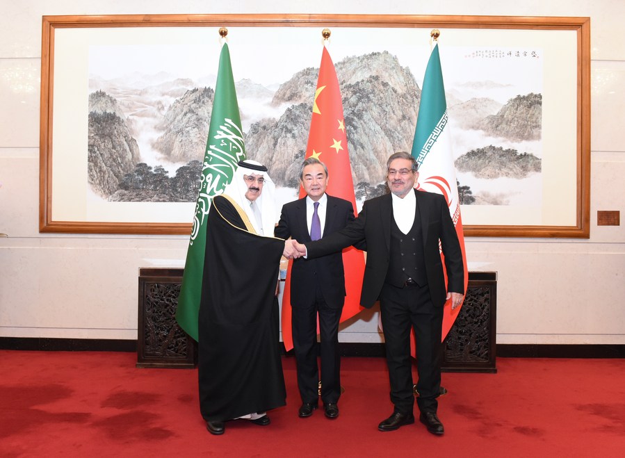 Wang Yi (C), a member of the Political Bureau of the Communist Party of China (CPC) Central Committee and director of the Office of the Foreign Affairs Commission of the CPC Central Committee, attends a closing meeting of the talks between the Saudi delegation led by Musaad bin Mohammed Al-Aiban (L), Saudi Arabia's minister of state, member of the Council of Ministers and national security advisor, and Iranian delegation led by Admiral Ali Shamkhani (R), secretary of the Supreme National Security Council of Iran, in Beijing, capital of China, March 10, 2023. /Xinhua