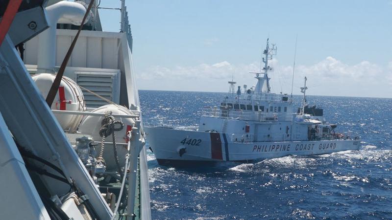 A China Coast Guard ship drives away Philippine vessels intruding into waters of China's Nansha Islands on Aug 5, 2023. /China Coast Guard