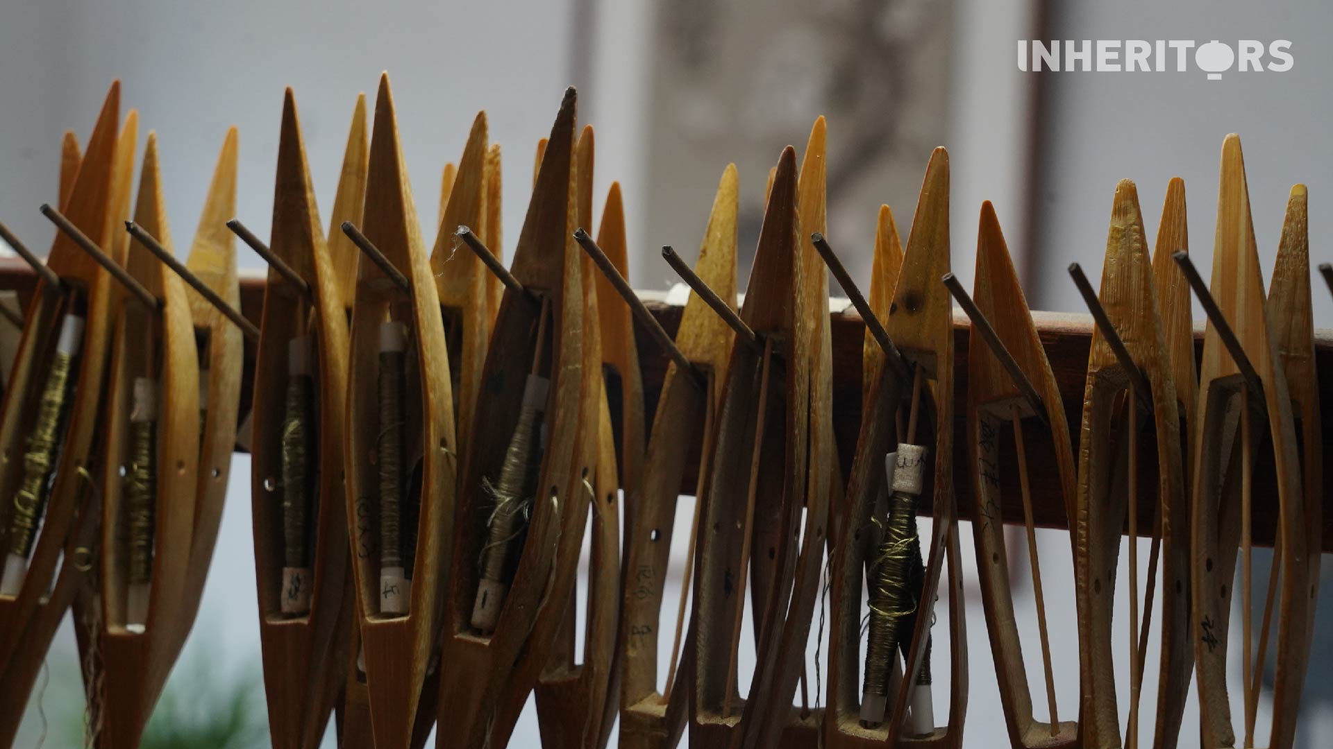 An undated photo shows a row of shuttles at a Kesi tapestry workshop in Suzhou, Jiangsu Province. /CGTN