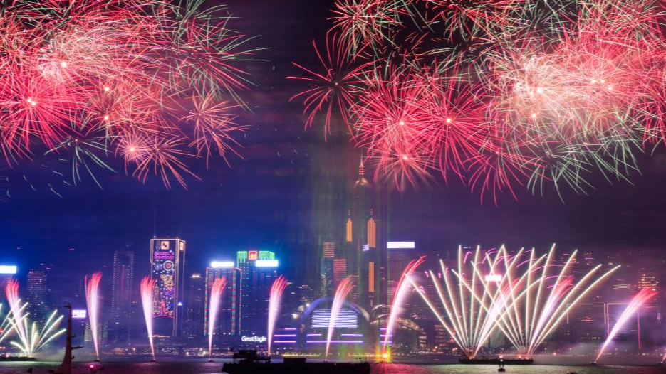 Fireworks in celebration of the New Year illuminate the sky over Victoria Harbour in Hong Kong, south China, January 1, 2024. /Xinhua