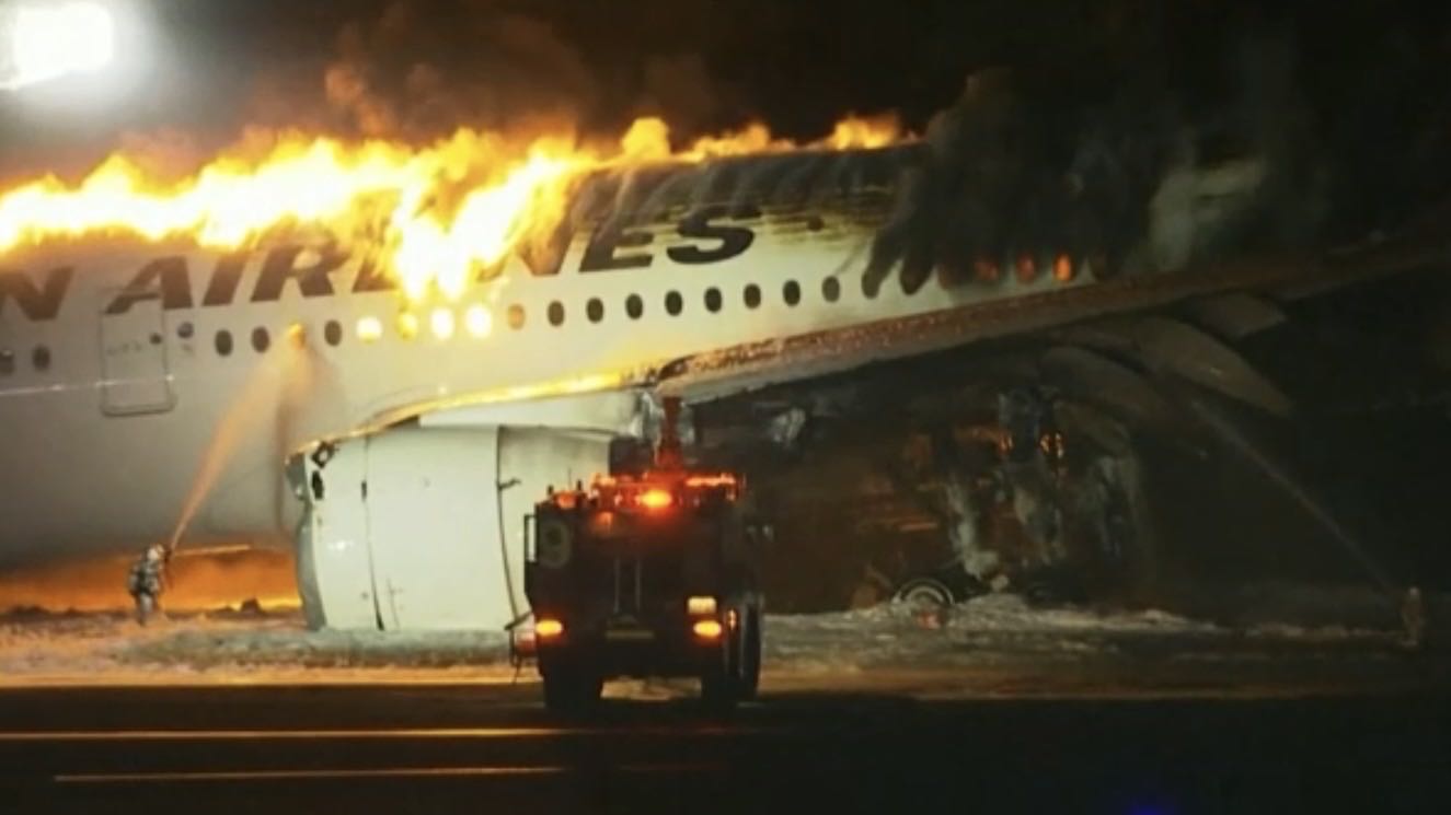 Live: Fire breaks out in plane on runway at Japan's Tokyo Haneda airport