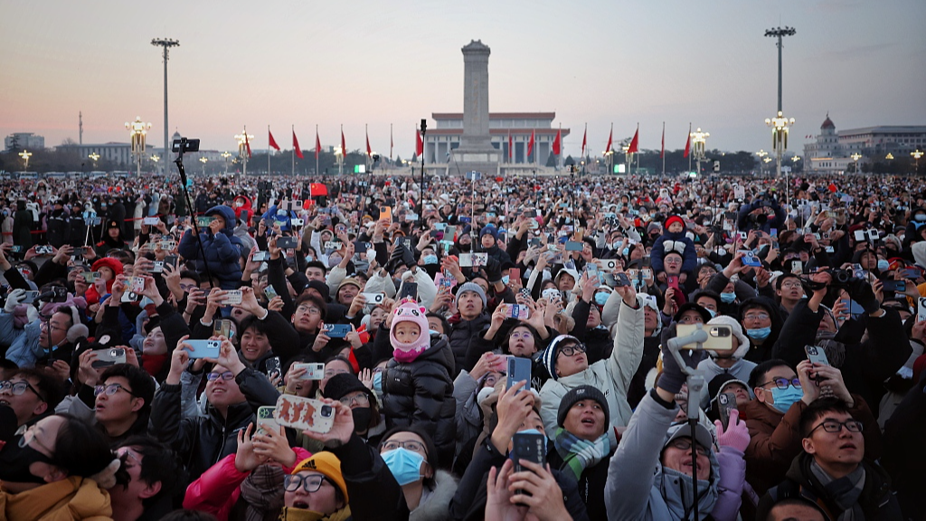 Tourists gather in Tiananmen Square to watch the flag-raising ceremony during the New Year's Day holiday in Beijing, capital of China, January 1, 2024. /CFP