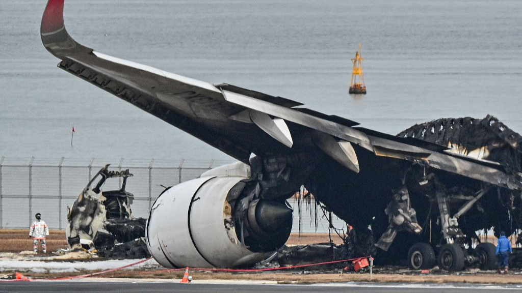 Live: Japan aircraft wreckage being removed after airport collision