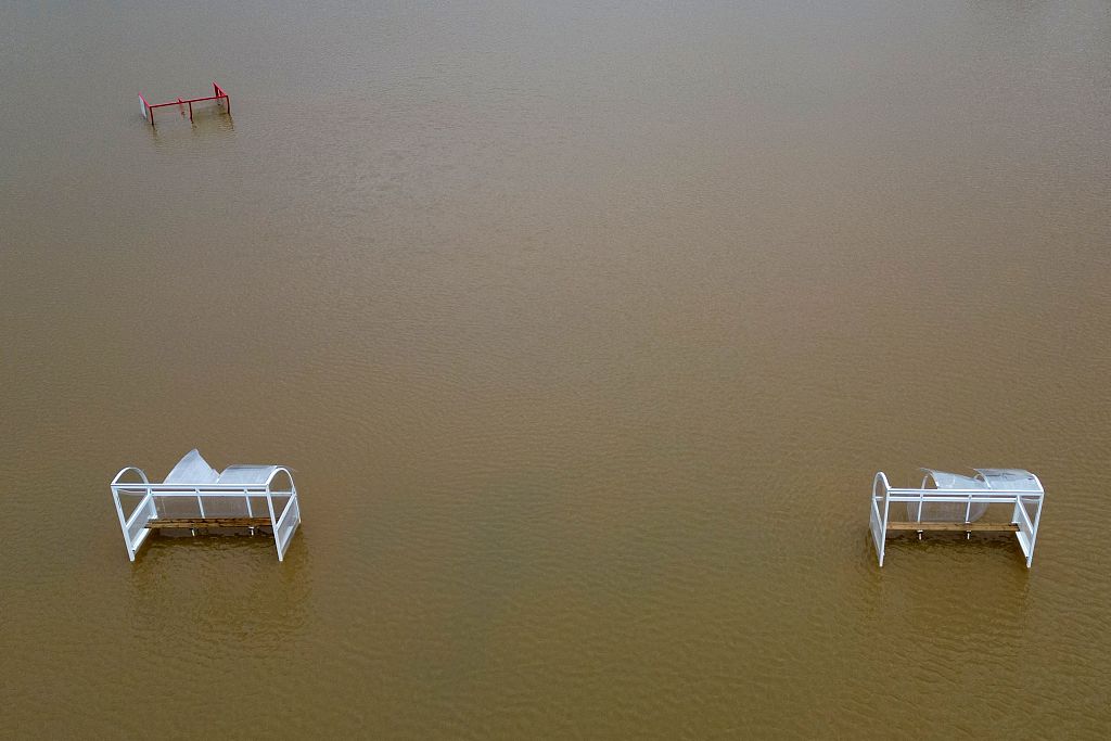 An aerial view shows flood water covering the pitch at Buckhurst Hill Football Club, northeast of London on January 5, 2024, after heavy rain brought flooding to much of the country, following Storm Henk. /CFP