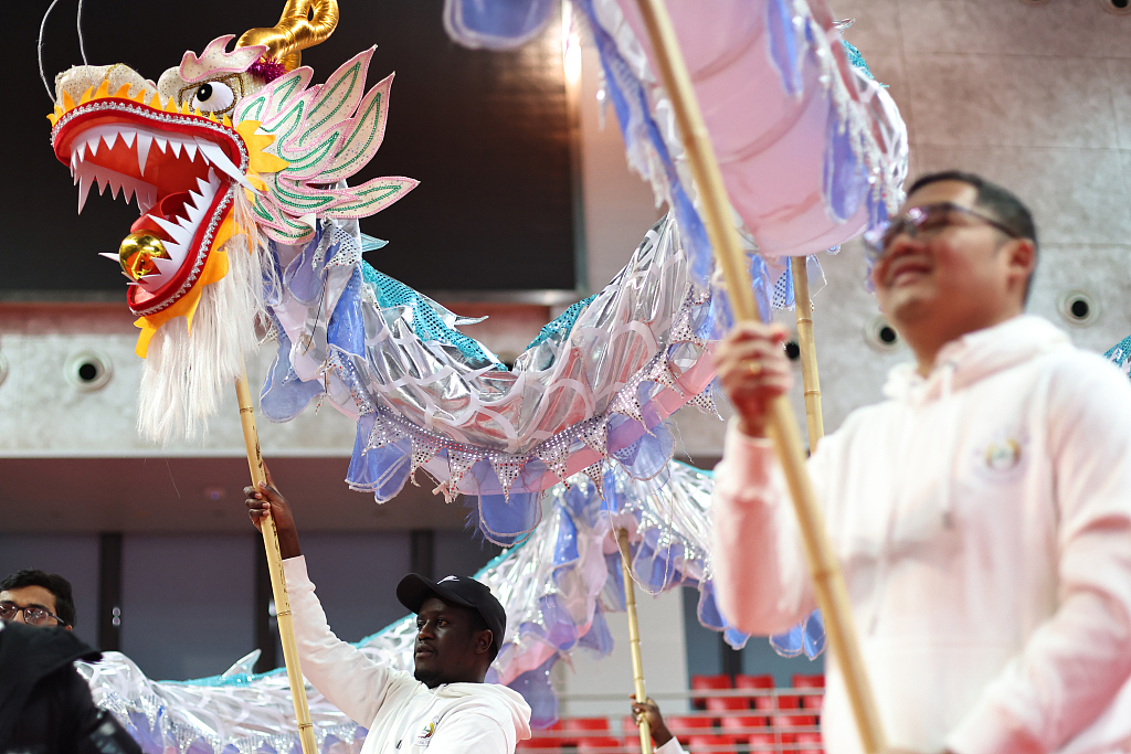 International students at Nanjing Agricultural University embrace the Year of the Loong as they participate in dragon dancing on January 5, 2024. /CFP