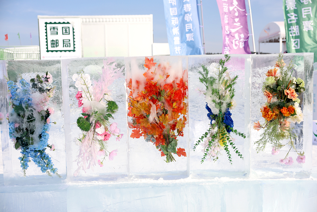 A photo taken on January 4, 2024 shows ice-encased flowers displayed on a street in Changchun, Jilin Province. /CFP