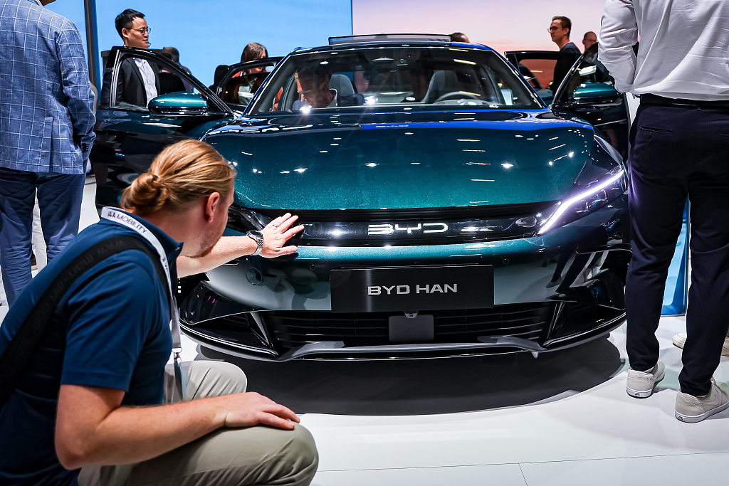 Car enthusiasts look at a BYD Han electric car at the IAA Mobility 2023 International Motor Show in Munich, Germany, September 6, 2023. /CFP