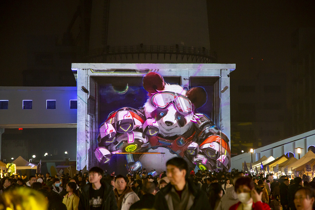Visitors attend the second Chongqing International Light Art Festival at a park in Chongqing on January 5, 2024. /CFP