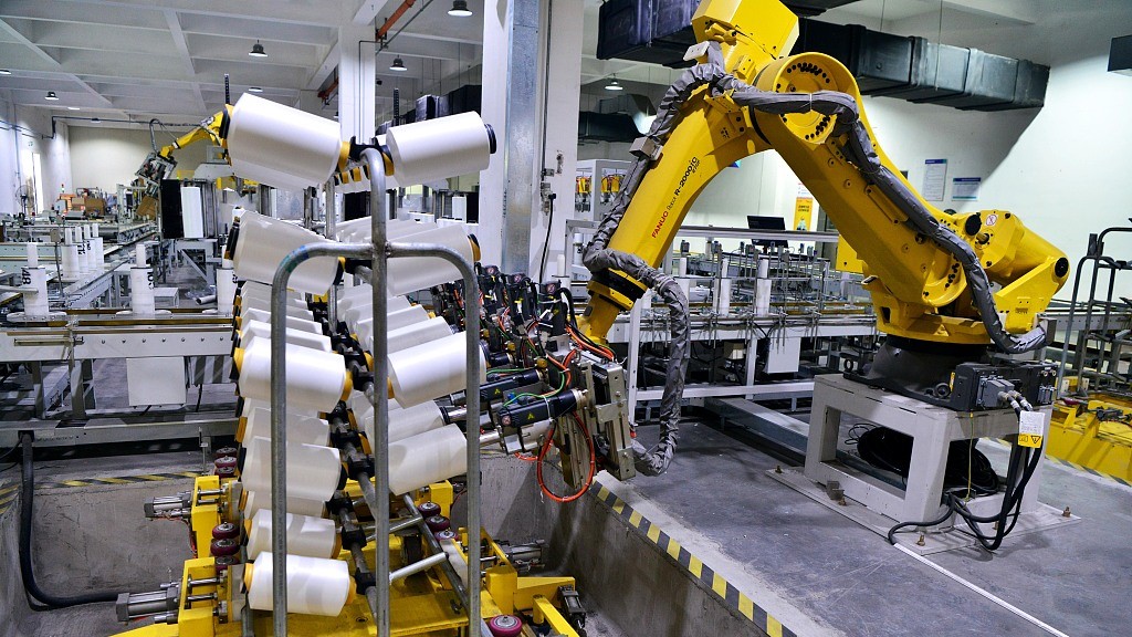 A robot arm operates on a factory plant in southeastern China's Fujian Province, May 31, 2023. /CFP