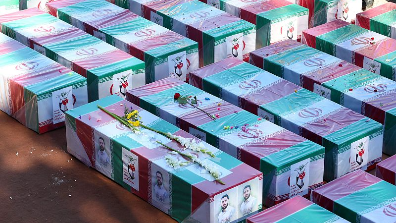 Coffins draped with the Iranian flag during the funeral for victims killed in the twin blasts, Kerman, Iran, January 5, 2024. /CFP
