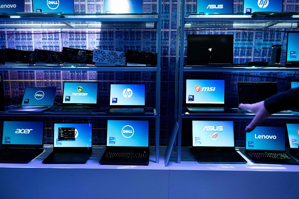 Laptop computers using Intel chips are shown at an Intel exhibit before CES, January 8, 2024. /CFP