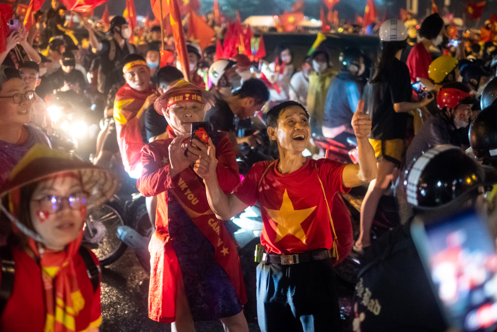 Football fans celebrate outside the My Dinh Stadium as Vietnam successfully defended the SEA Games men's football gold medal after beating Thailand 1-0 in the final on May 22, 2022 in Hanoi, Vietnam. /CFP