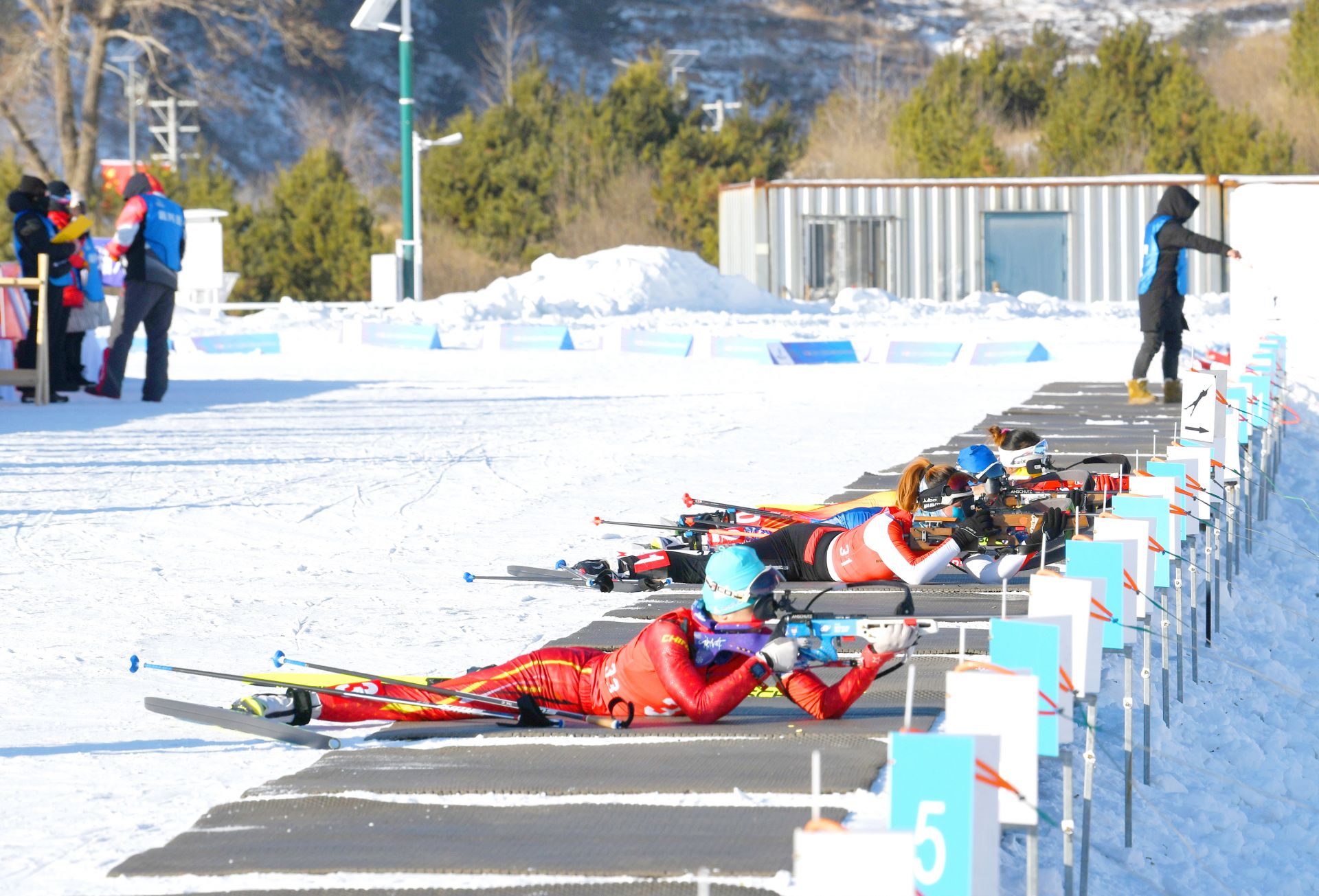 Athletes compete in the sport shooting segment of the biathlon during China's National Biathlon Championships in Liangcheng County, China, January 4, 2024. /Inner Mongolia News 