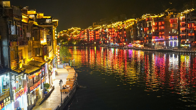 Zhenyuan Ancient Town is seen lit up at night by an array of lights in Guizhou Province, January 9, 2024. /CFP