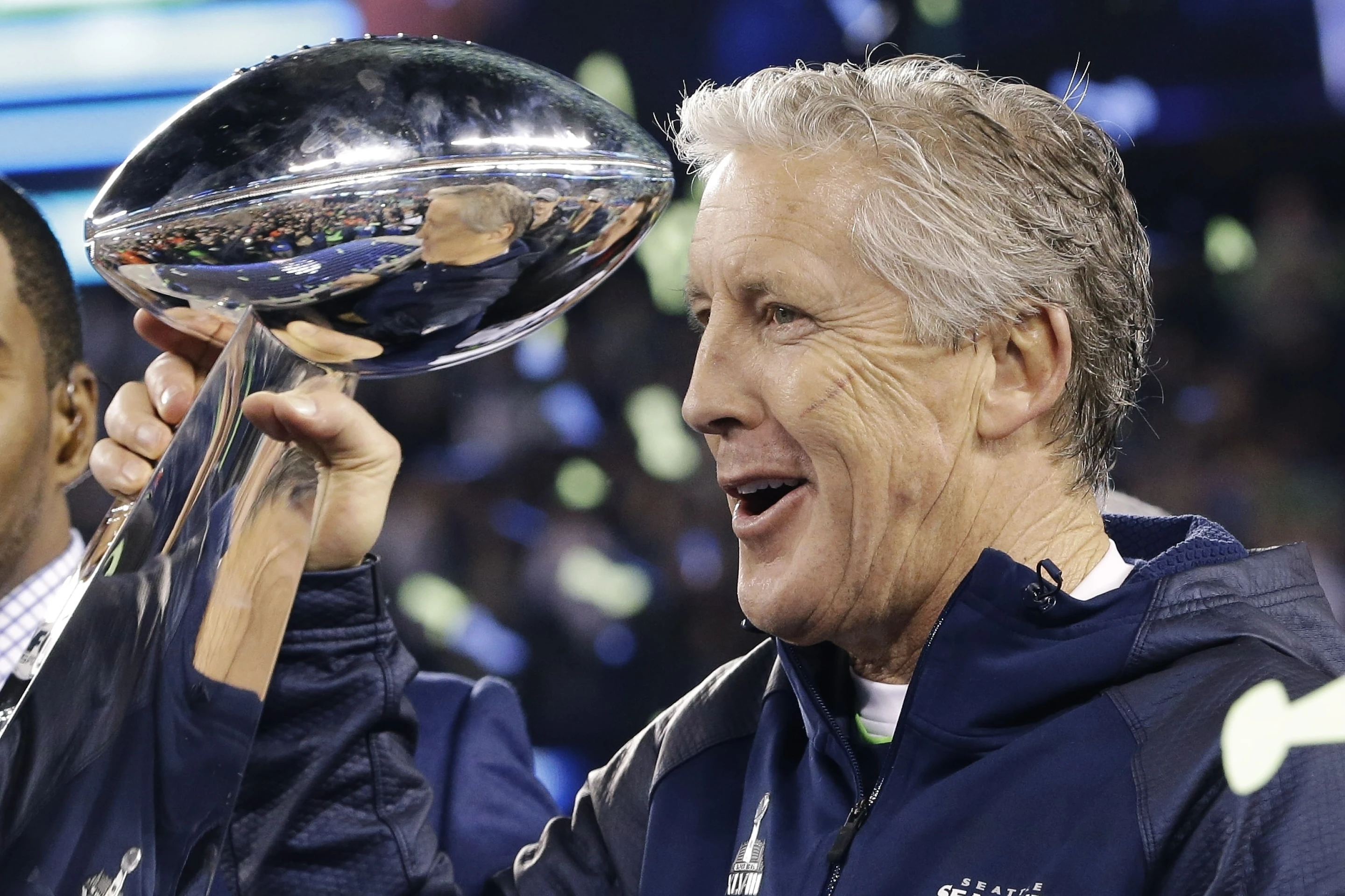 Pete Carroll, head coach of the Seattle Seahawks, celebrates with the Vince Lombardi Trophy after the 43-8 win over the Denver Broncos in Super Bowl XLVIII at the MetLife Stadium in East Rutherford, New Jersey, February 2, 2014. /AP