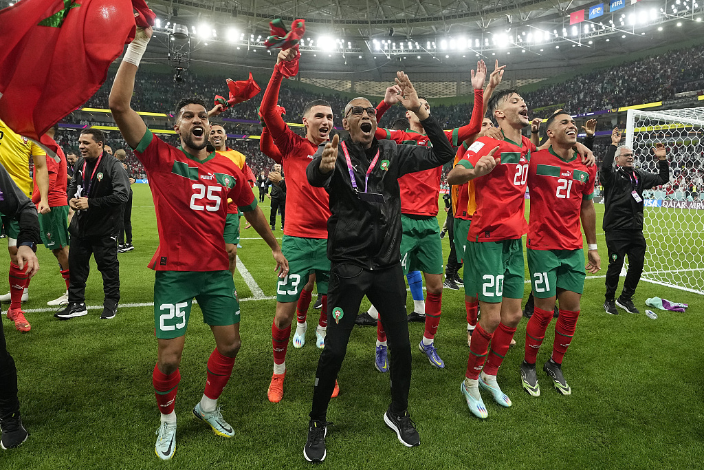 File photo shows Morocco's players celebrating after winning their FIFA World Cup quarterfinal match against Portugal at Al Thumama Stadium in Doha, Qatar, December 10, 2022. /CFP