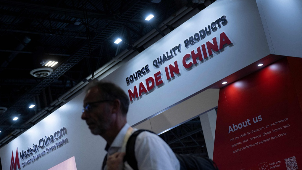 A participant walks by the made-in-china.com exhibition booth at the Las Vegas Convention Center during 2024 CES, Las Vegas, Nevada, USA, January 11, 2024. /CFP