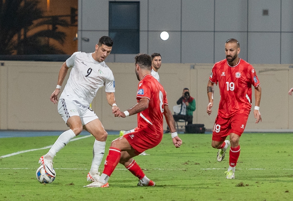 Tamer Seyam (9) of Palestine in action against Hassan Ali Saad (C) of Lebanon during the 2026 FIFA World Cup AFC qualifying match against Lebanon at the Khalid Bin Mohammed Stadium in Sharjah, the UAE, on November 16, 2023. /CFP
