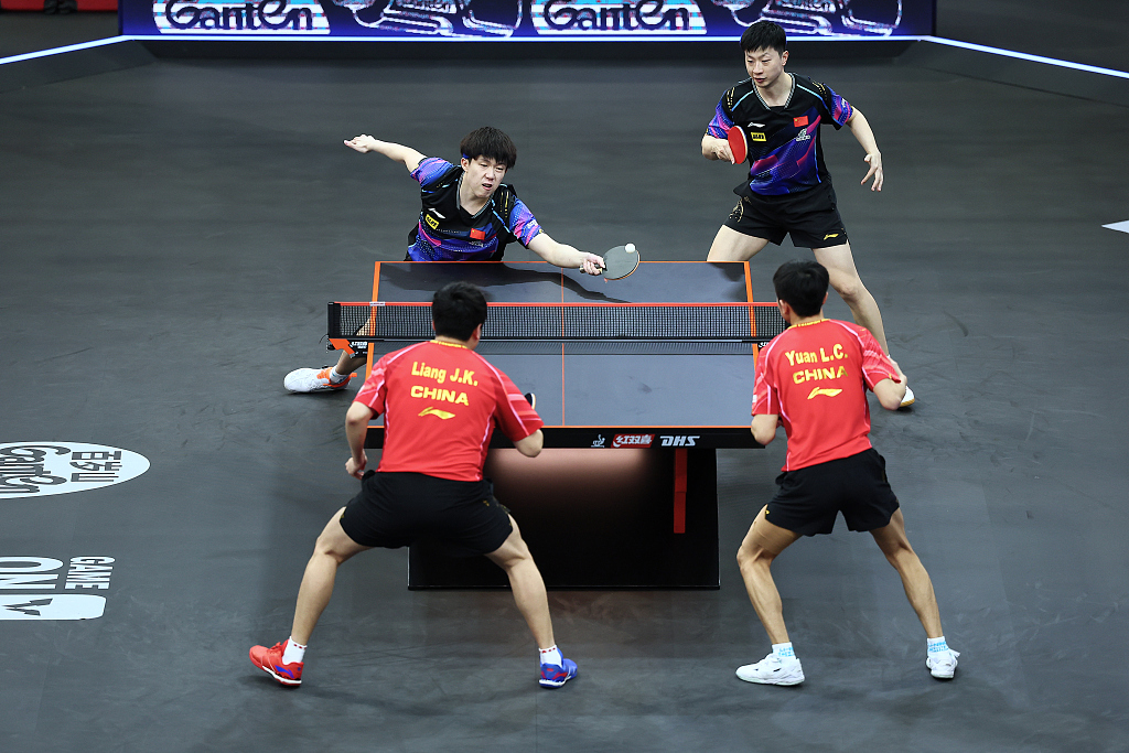 China's Liang Jingkun (L in red shirts)/Yuan Licen and Wang Chuqin/Ma Long in action during the men's doubles final at the WTT Star Contender in Doha, Qatar, January 12, 2024. /CFP