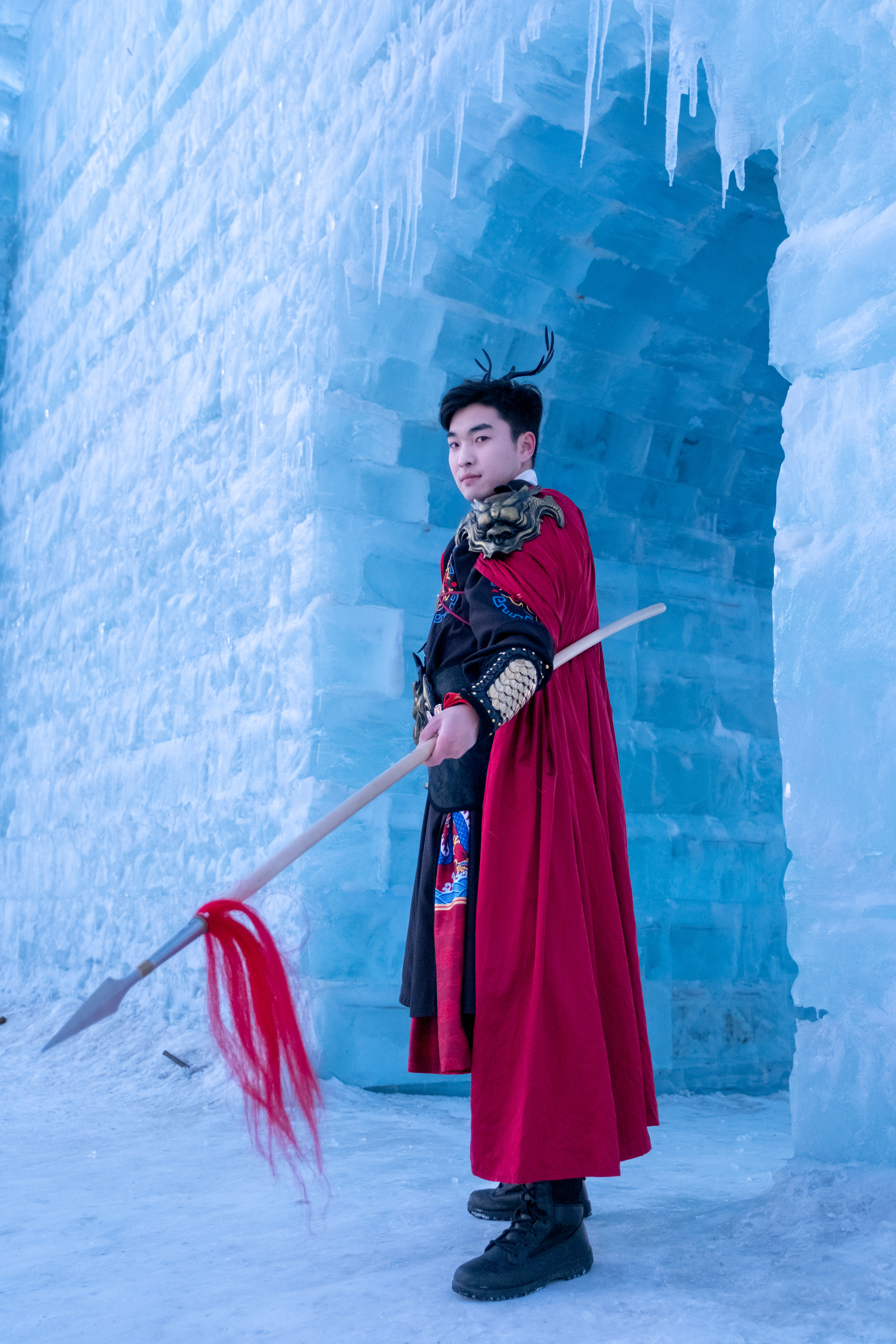 A man in traditional hanfu attire poses for a photo at Changchun Ice and Snow New World in northeast China's Jilin Province, on January 9, 2024. /IC