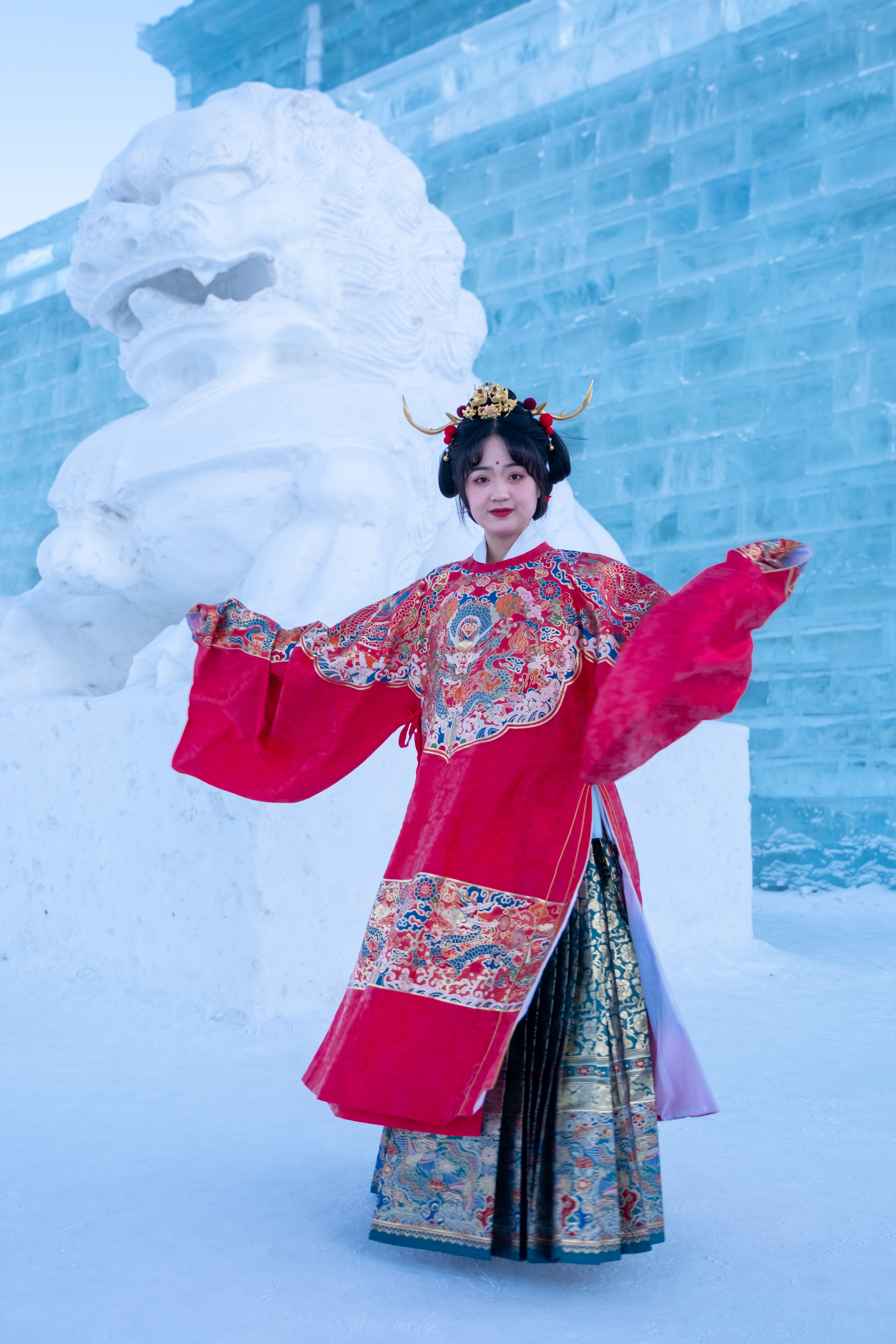A woman dressed in traditional hanfu attire poses for a photo at Changchun Ice and Snow New World in northeast China's Jilin Province, on January 9, 2024. /IC