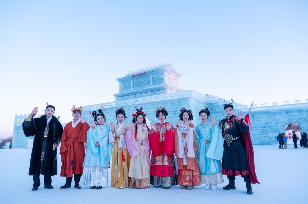 Young people wearing traditional hanfu attire pose for a photo at Changchun Ice and Snow New World in northeast China's Jilin Province, on January 9, 2024. /IC