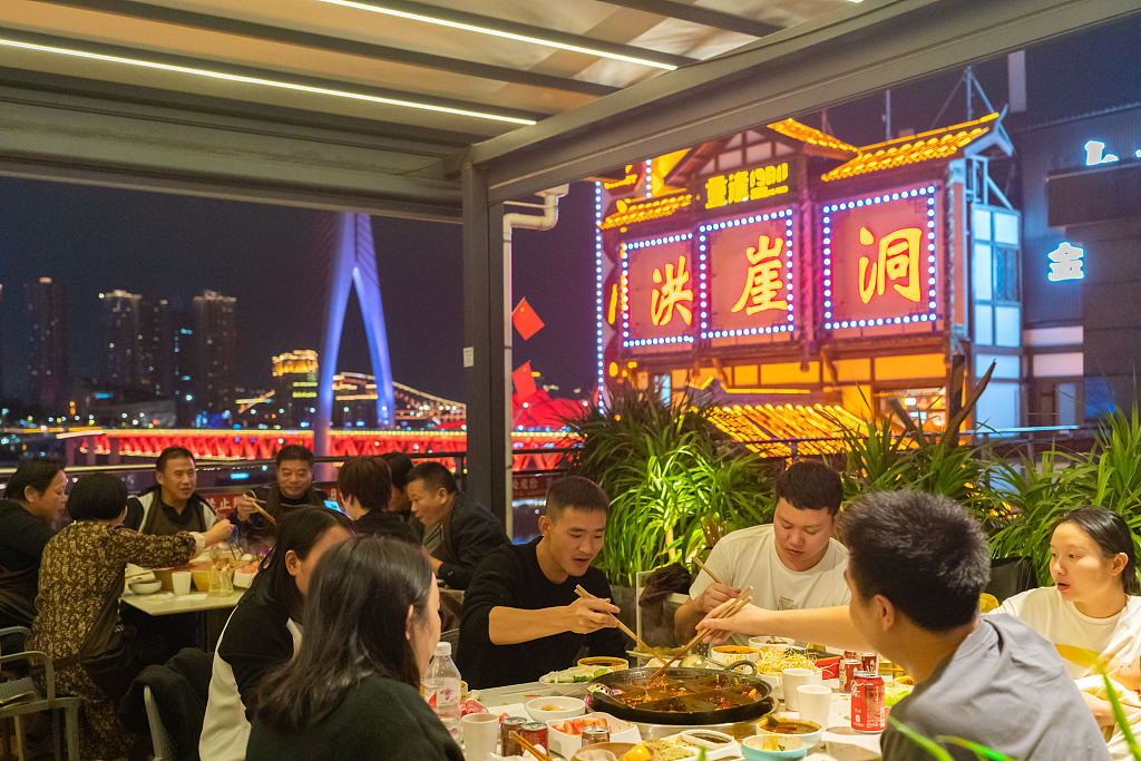 A file photo shows people enjoy hotpot at a restaurant in Chongqing Municipality, southwest China. /CFP