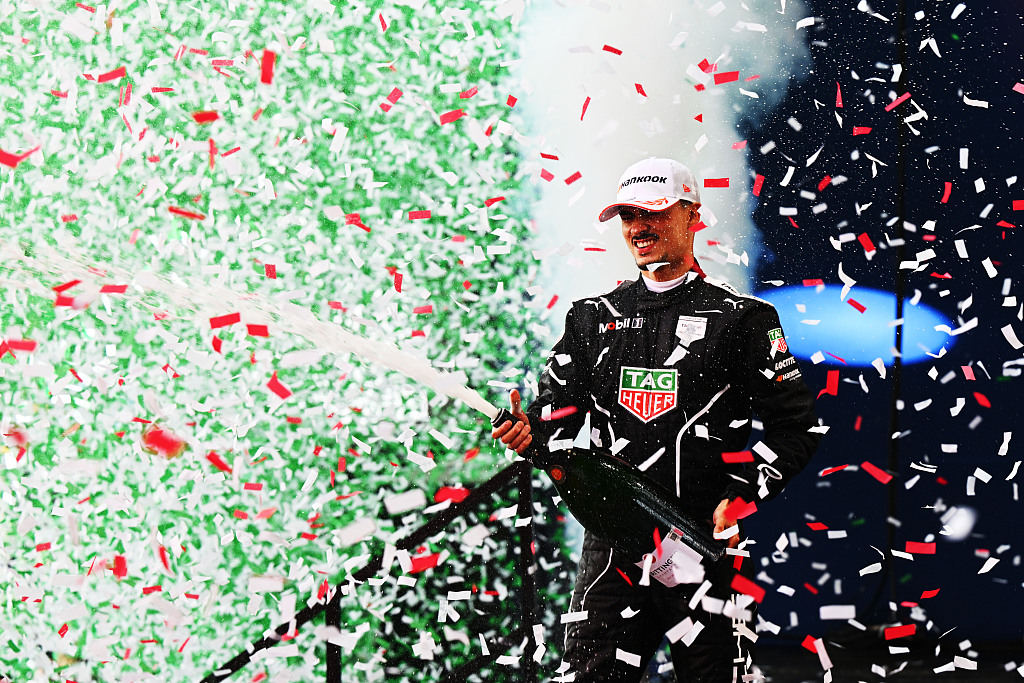 Pascal Wehrlein of Team TAG Heuer Porsche sprays champagne after winning this season's first Formula E race in Mexico City, Mexico, January 13, 2024. /CFP