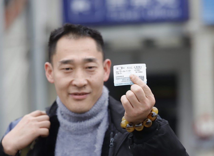 A passenger shows his train ticket for the upcoming Spring Festival travel rush, in Kaili City of Qiandongnan Miao and Dong Autonomous Prefecture, southwest China's Guizhou Province, January 12, 2024. /Xinhua