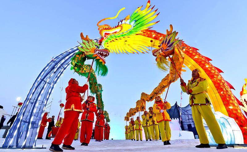 Performers showcase dragon dances during a local ice and snow festival in Zhangye City, Gansu Province, January 13, 2024. /CFP