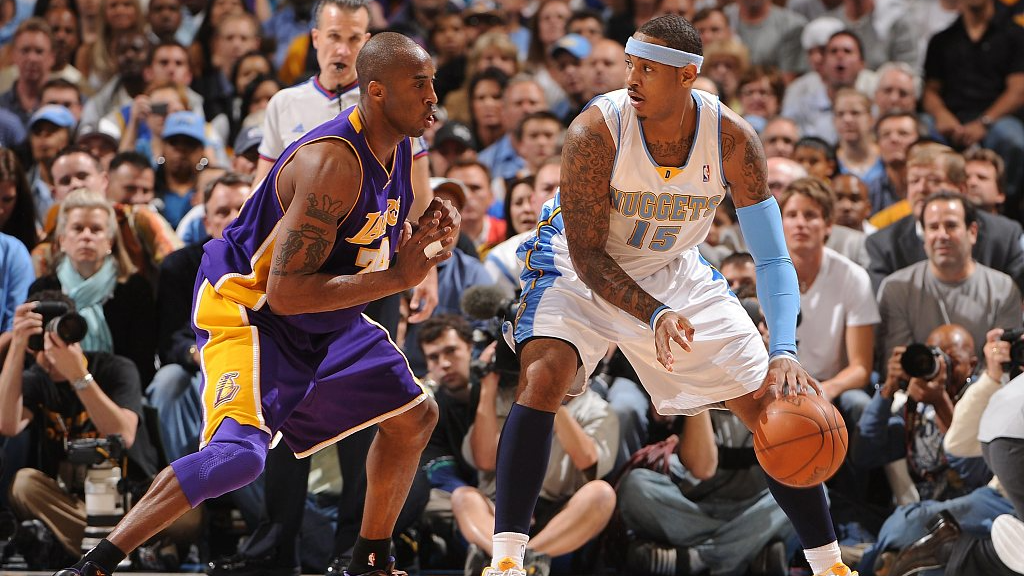Carmelo Anthony (R) of the Denver Nuggets posts up in front of Kobe Bryant of the Los Angeles Lakers in Game 4 of the NBA Western Conference Finals at the Pepsi Center in Denver, Colorado, May 25, 2009. /CFP