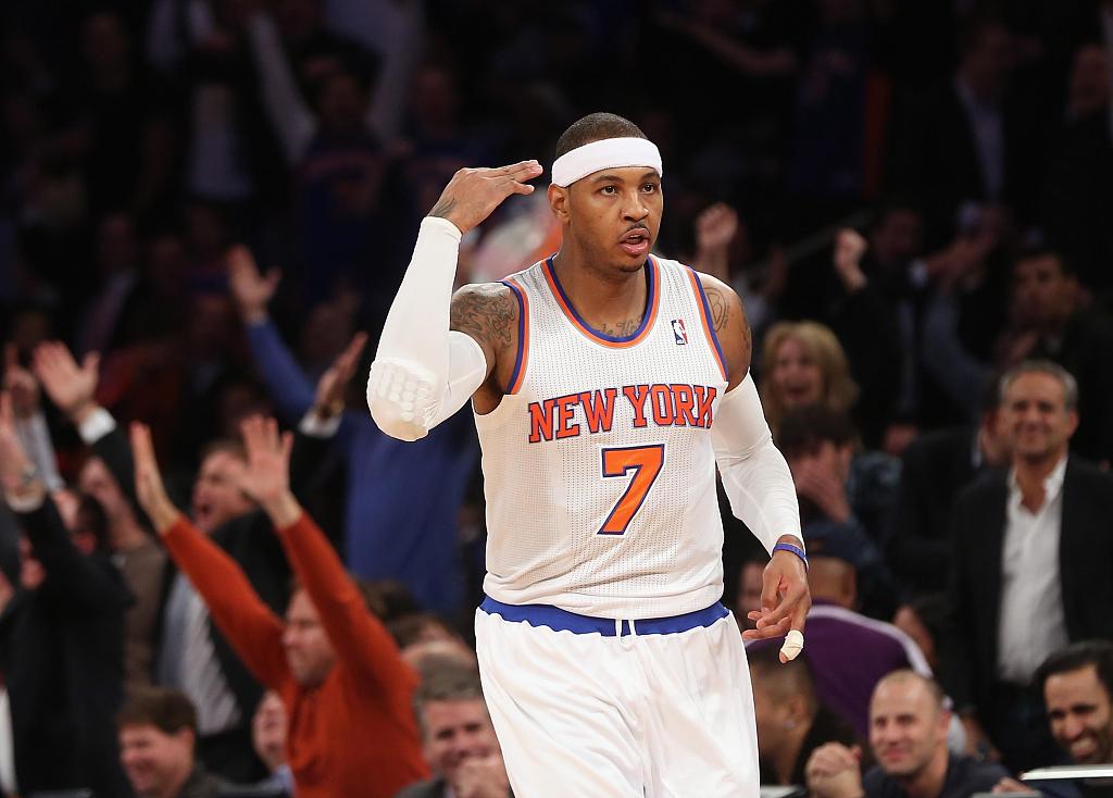 Carmelo Anthony of the New York Knicks reacts after making a shot in the game against the Los Angeles Lakers at Madison Square Garden in New York City, December 13, 2012. /CFP
