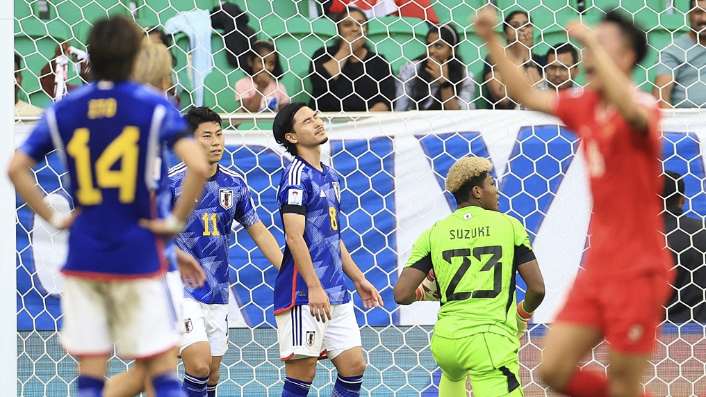 Japan's Takumi Minamino (C) is dejected after conceding the second goal during the first half of the Asian Cup at Al-Thumama Stadium stadium, Al-Thumama City, Qatar, January 14, 2024. /CFP