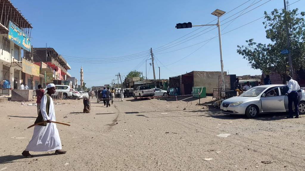 Sudanese civilians walk through an empty road with most shops closed for security reasons in Gedaref city in eastern Sudan, January 10, 2024. /CFP