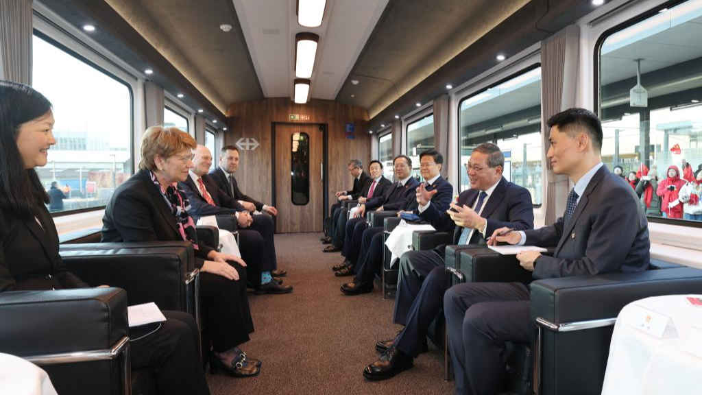 Chinese Premier Li Qiang engages in candid exchanges with President of the Swiss Confederation Viola Amherd in a relaxing and friendly atmosphere on a special train from Zurich to Bern, the capital of Switzerland, January 14, 2024. /Xinhua