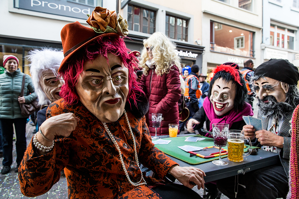 A file photo shows people in costume celebrating Fasnacht in Lucerne, Switzerland. /CFP