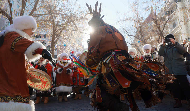 Hezhe people perform traditional dances and sing songs to demonstrate their unique culture to visitors in Harbin City, Heilongjiang Province, January 15, 2024. /CFP