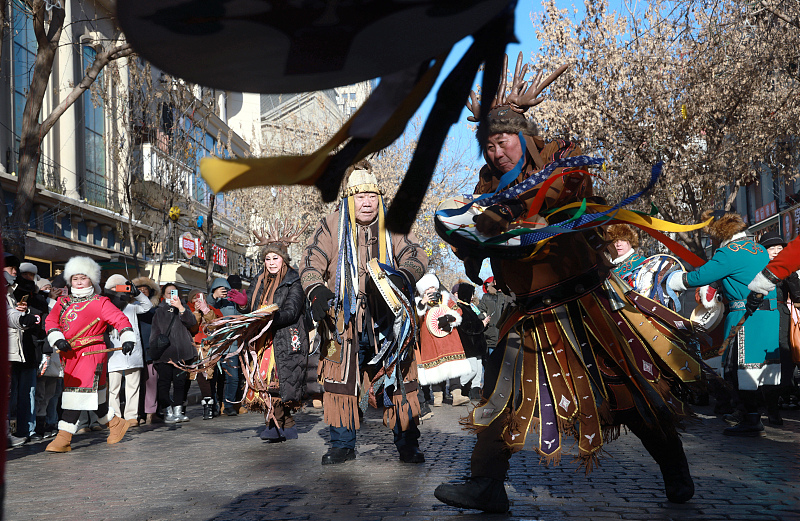 Hezhe people perform traditional dances and sing songs to demonstrate their unique culture to visitors in Harbin City, Heilongjiang Province, January 15, 2024. /CFP