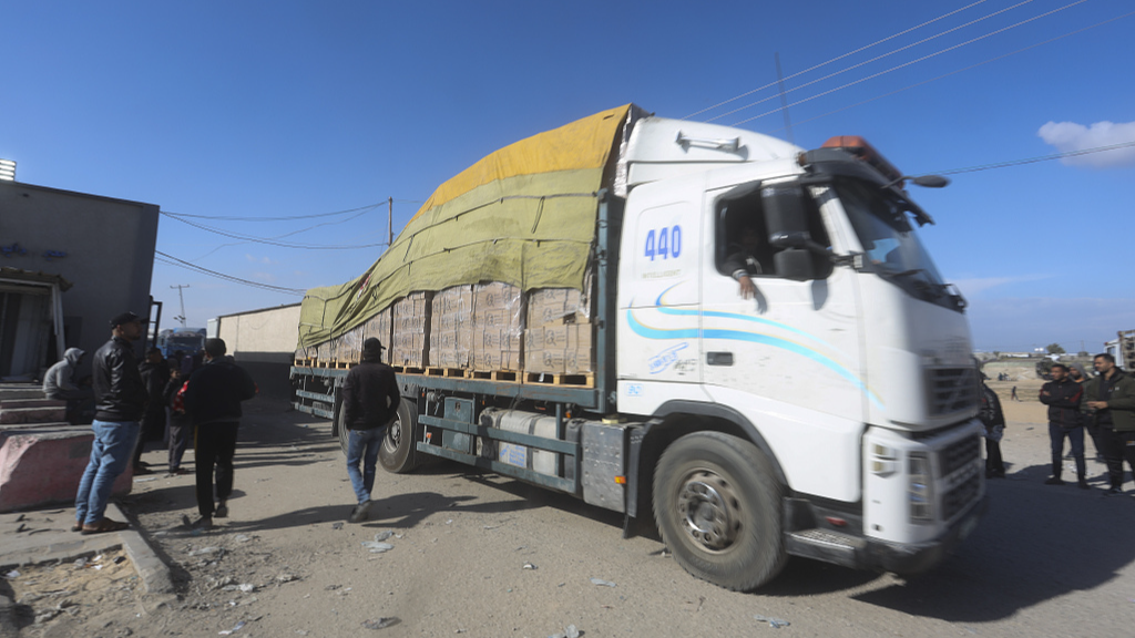 Humanitarian aid trucks enter the Gaza Strip from Israel through the Kerem Shalom crossing in Rafah, January 14, 2024. /CFP