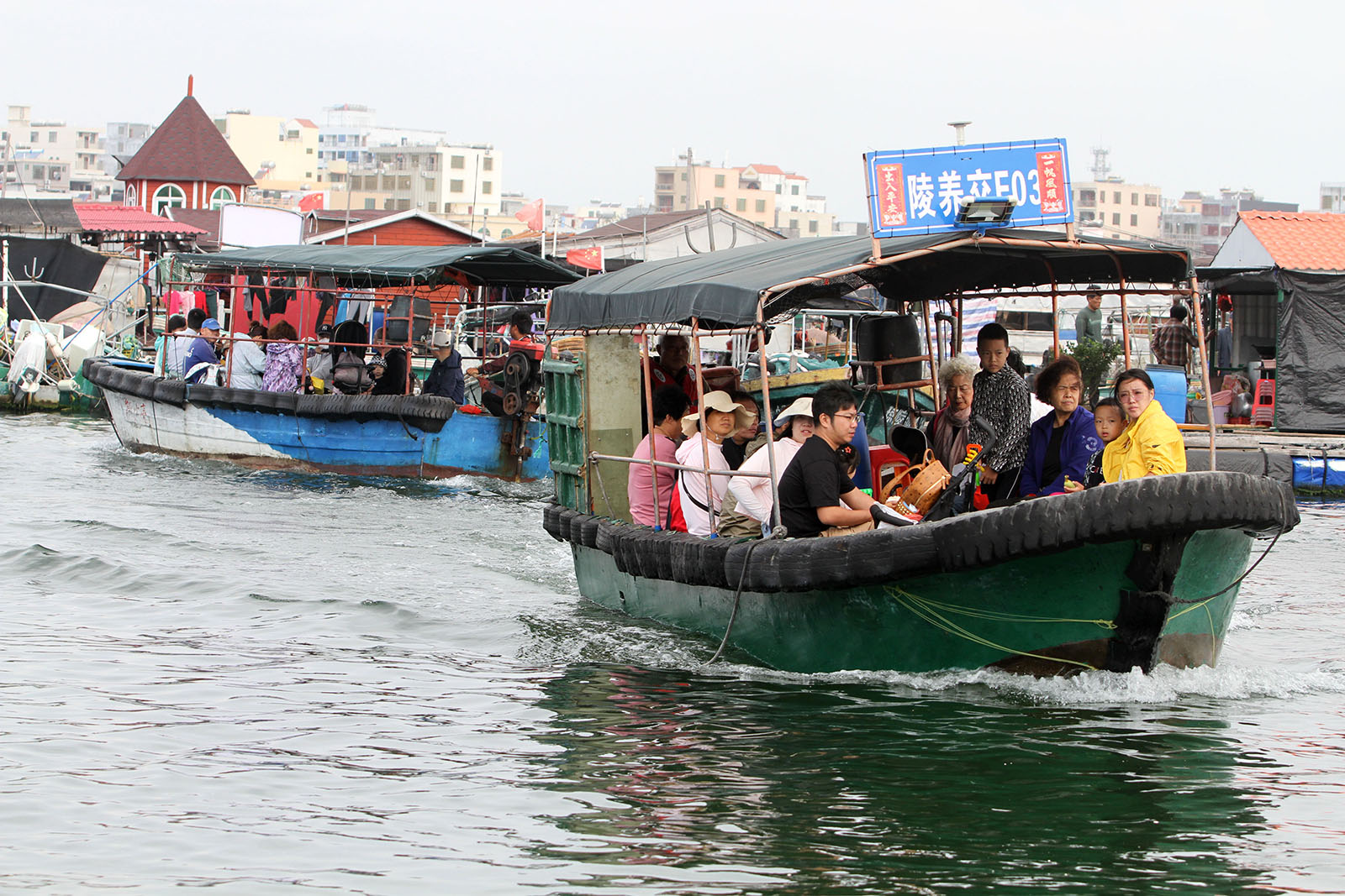 Visitors experience the lifestyle of fishermen at Danjia fishing village in Lingshui, Hainan Province on February 16, 2023. /IC