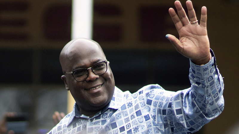 Felix Tshisekedi waves to his supporters after casting his ballot inside a polling station during the presidential elections in Kinshasa, Democratic Republic of Congo, December 20, 2023. /CFP