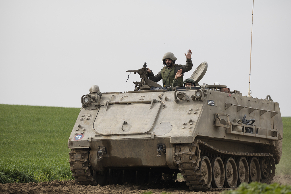  Israeli armored personnel carrier moves along the border with the Gaza Strip on January 17, 2024 in Southern Israel. /CFP