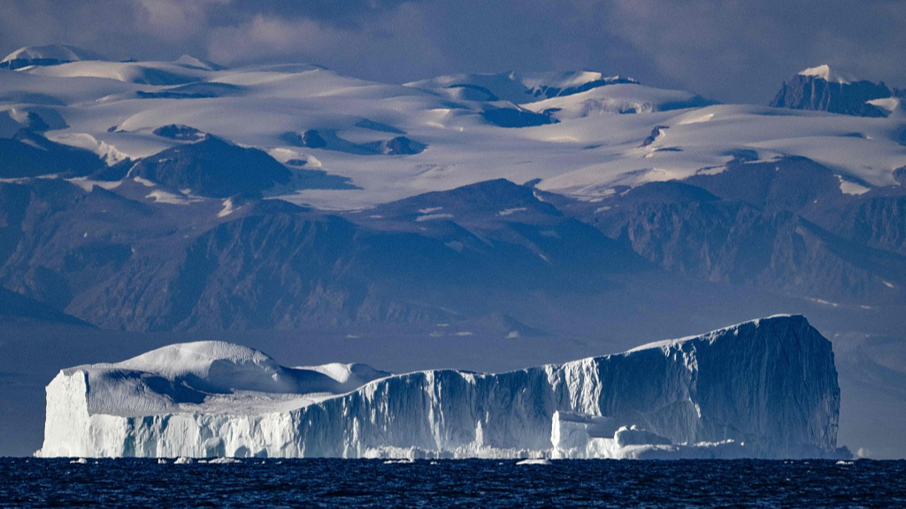 An iceberg, approximately a few hundred metres long, drifting along the Scoresby Sound Fjord, Eastern Greenland, August 16, 2023. /CFP