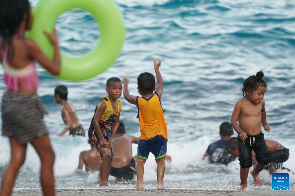 Locals play on a beach in Nauru, January 17, 2024. /Xinhua