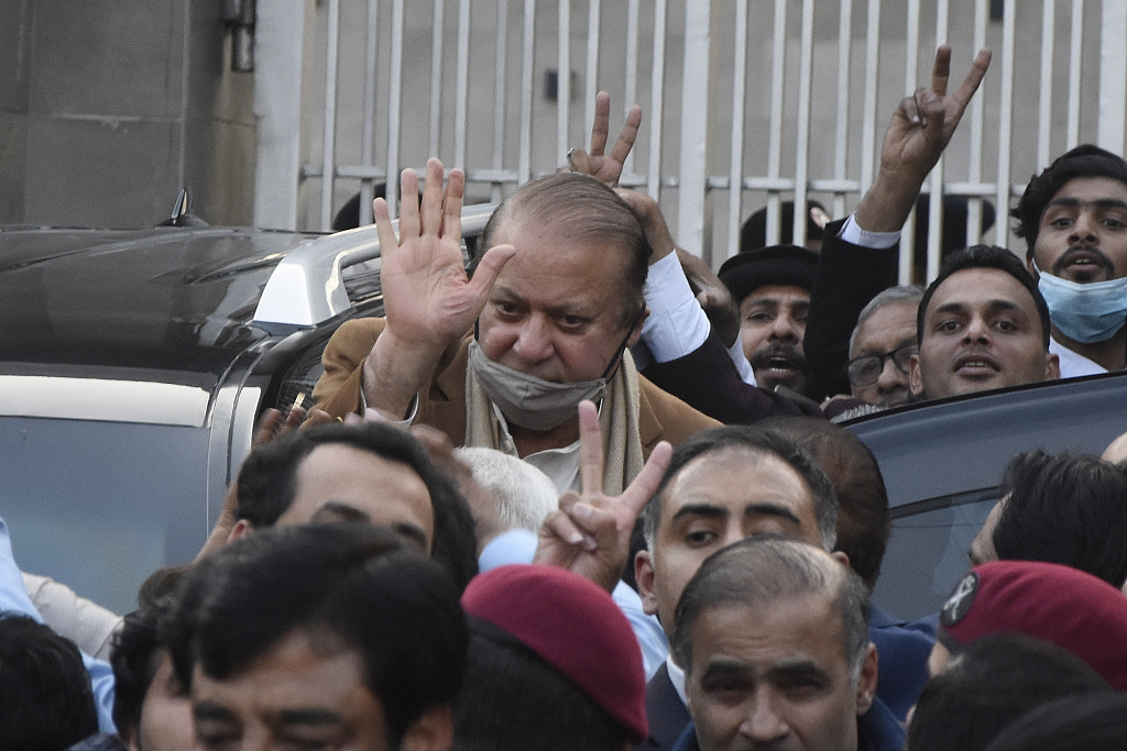 Pakistan's former Prime Minister Nawaz Sharif, center in brown coat, waves to his supporters in Islamabad, Pakistan, December 12, 2023. /CFP