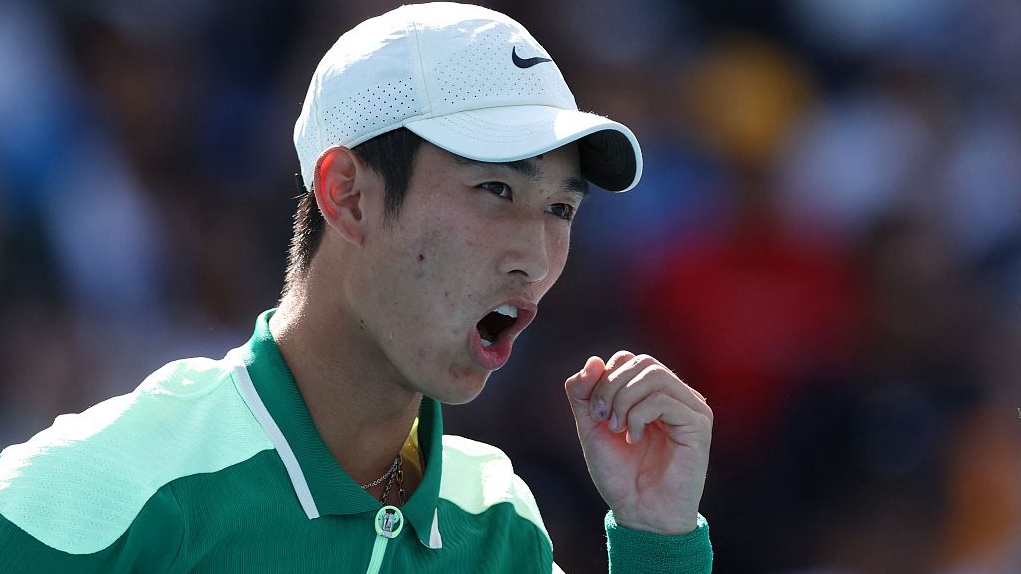 China's Shang Juncheng reacts after winning a point against India's Sumit Nagal during their men's singles match of the Australian Open in Melbourne, Australia, January 18, 2024. /CFP